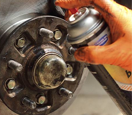 brake cleaner being sprayed on surface